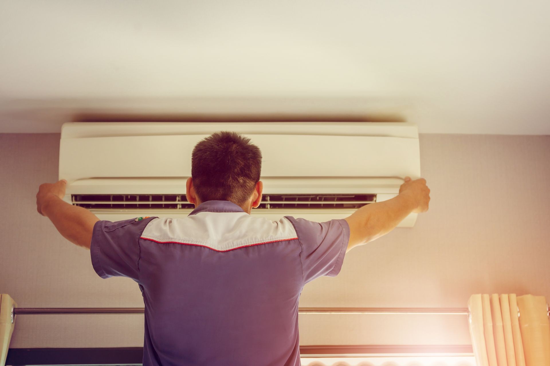 Close up of Air Condition, repairman on the floor fixing air conditioning system, Maintenance and Repair concept.