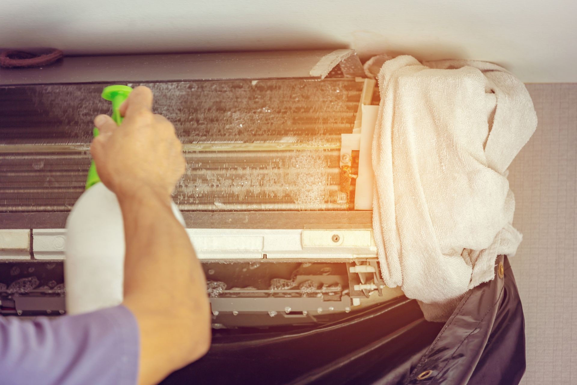 Close up of Air Conditioning Repair, repairman on the floor fixing air conditioning system